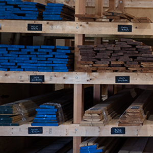 Warehouse shelving of hardwood stock in labelled bins